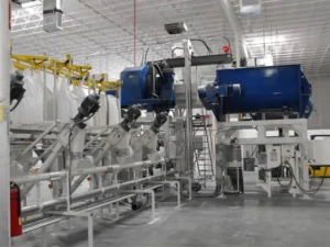 Flexible screw conveyors feeding the aero mechanical conveyors