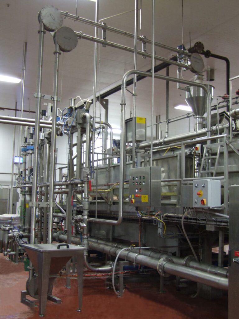 Aero-mechanical conveyor in a production facility