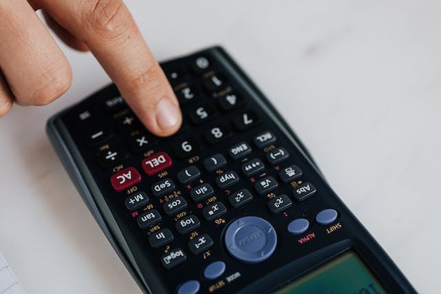 A person using a calculator