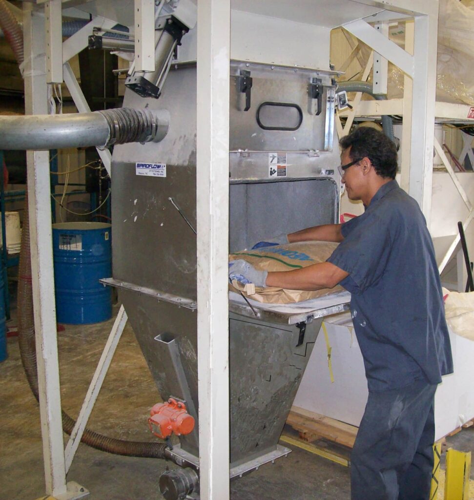 Jowat Spiroflow bulk bag discharger and a person working next to it 