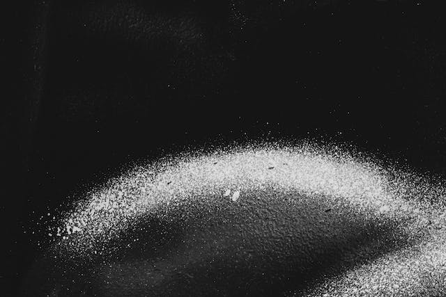 White dust on a black background