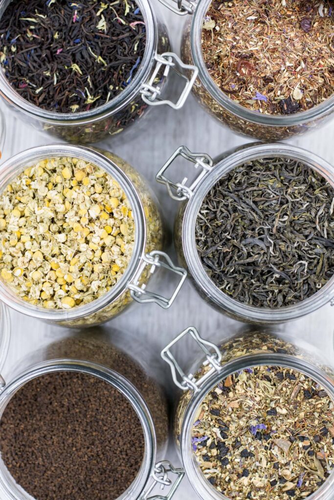 Different tea leaves in glass jars